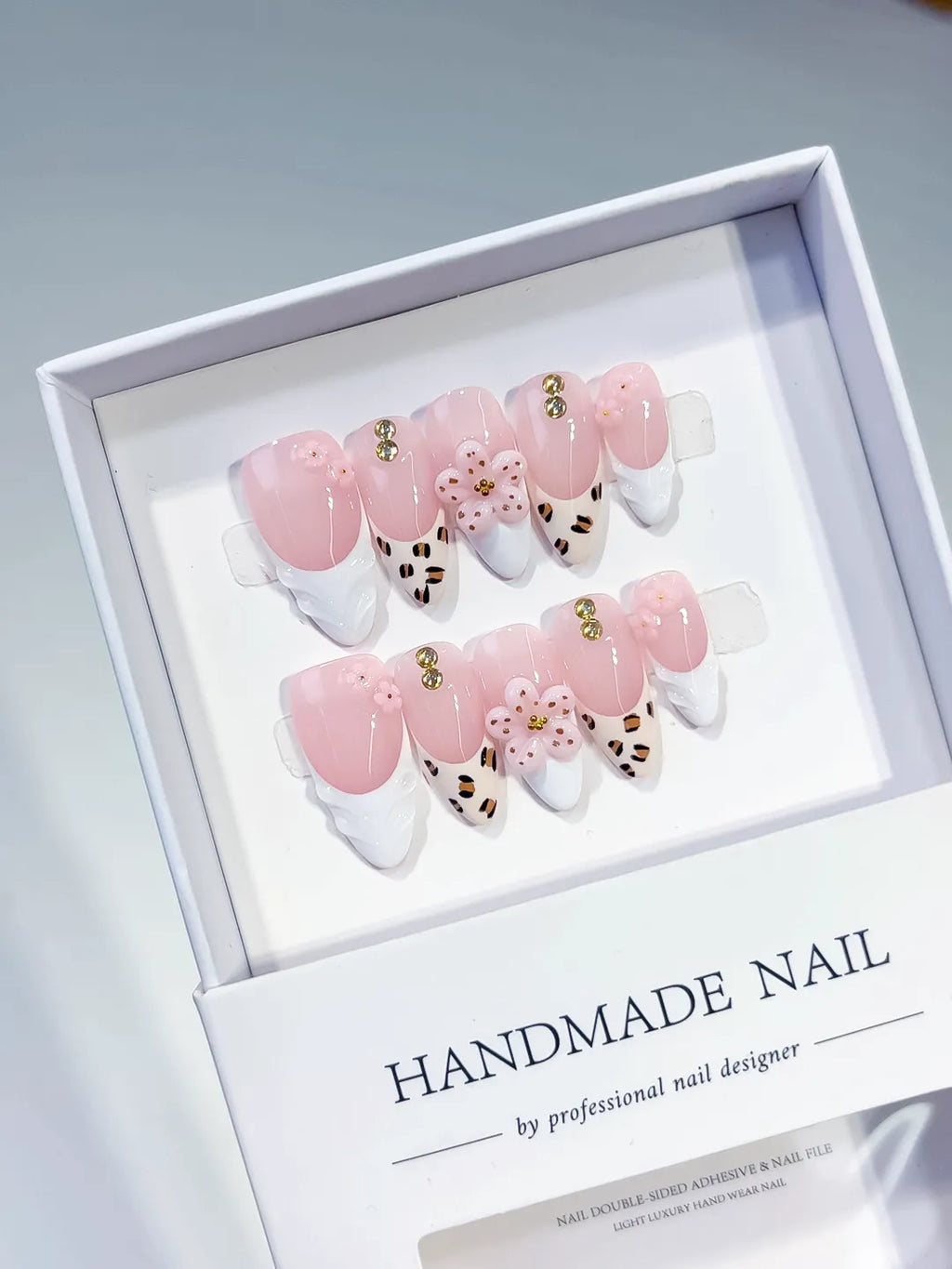 Pink White Brown Gold French tip Flower Animal Print Stud press on nails angled view