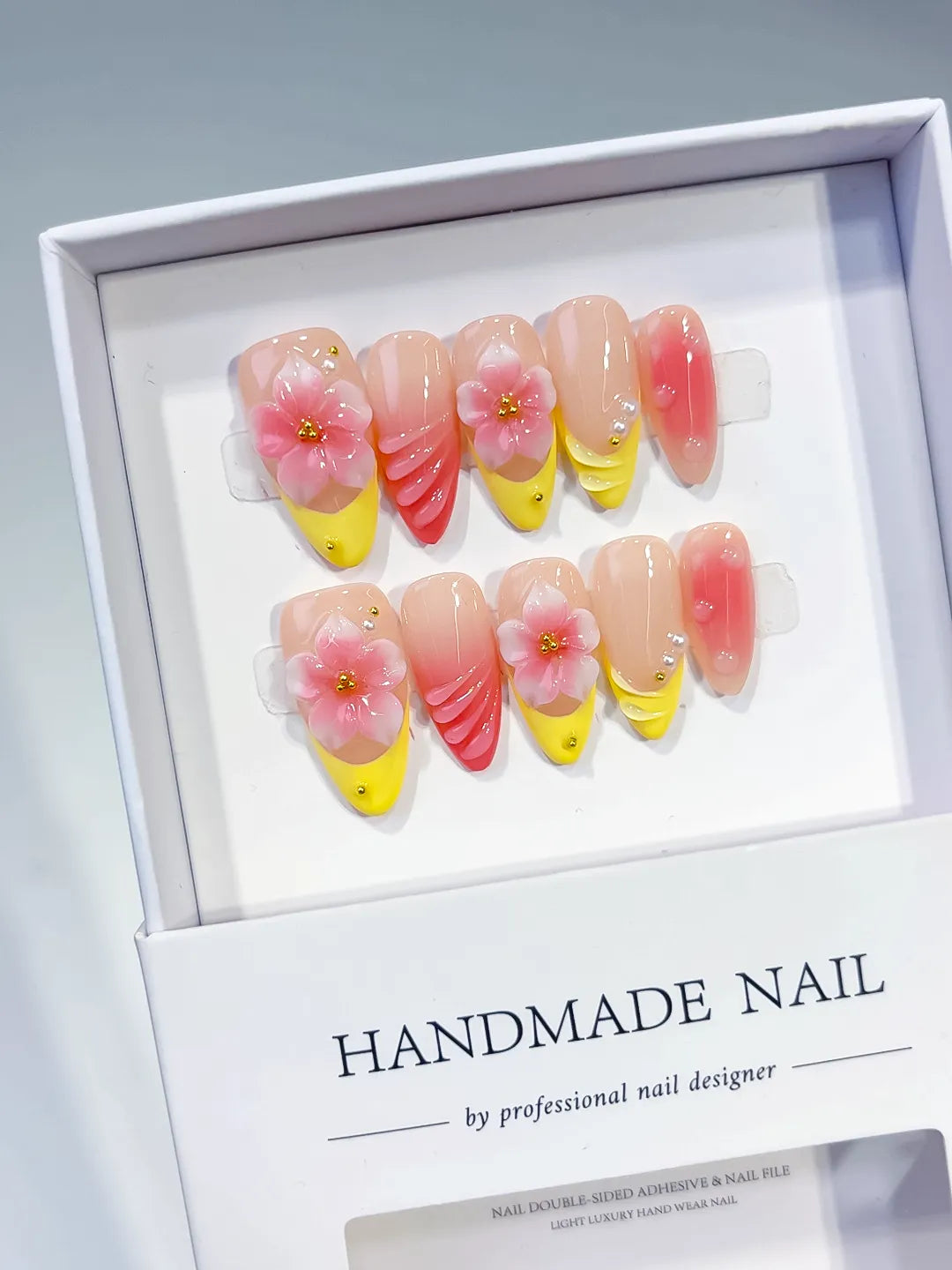 Nude Yellow Pink French tip Flower Shell press on nails angled view