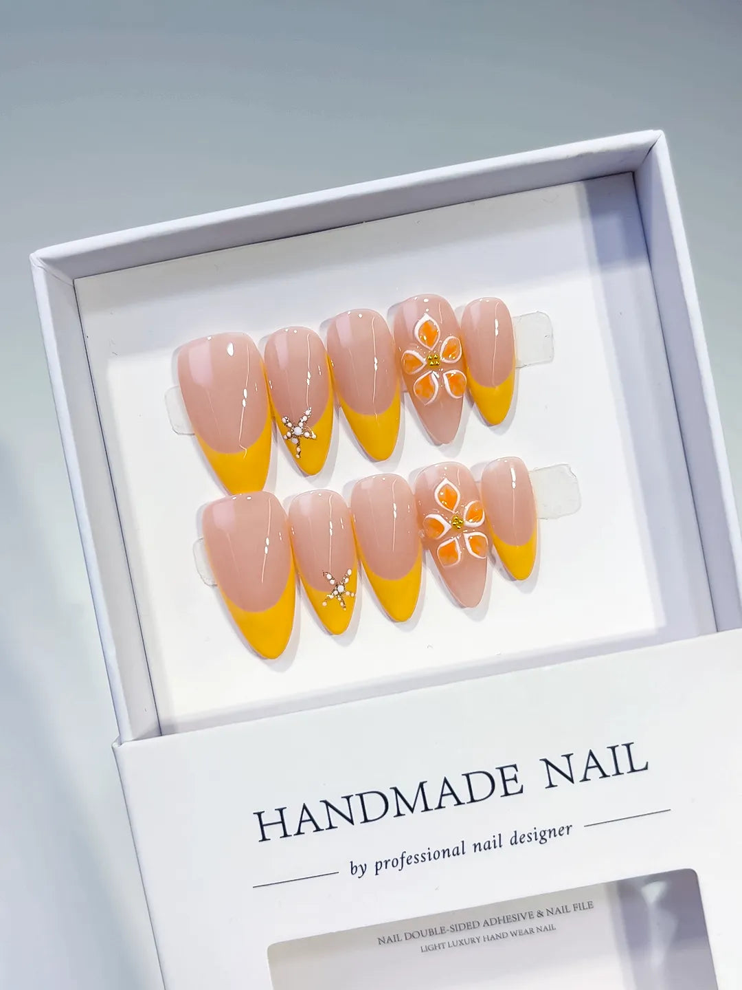 Nude Yellow White French tip Flower Rhinestone press on nails angled view