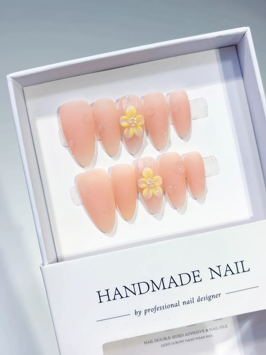 Nude Yellow Solid color Flower Rhinestone press on nails angled view