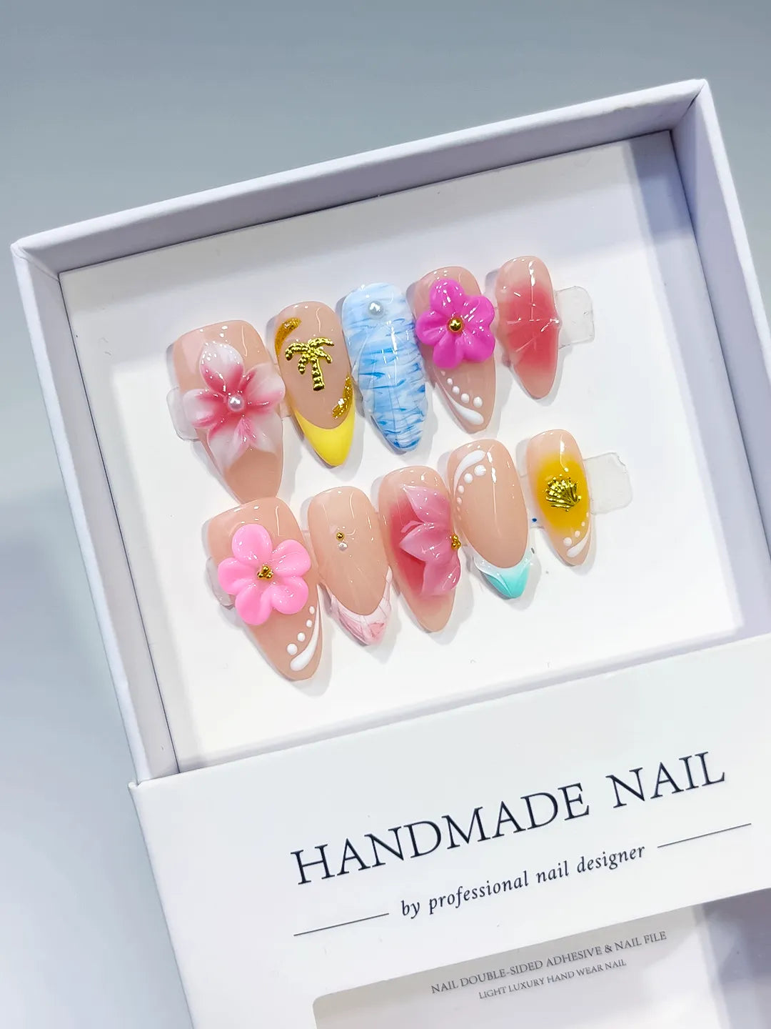 Nude Pink Blue Yellow White Abstract Flower Star Shell press on nails angled view
