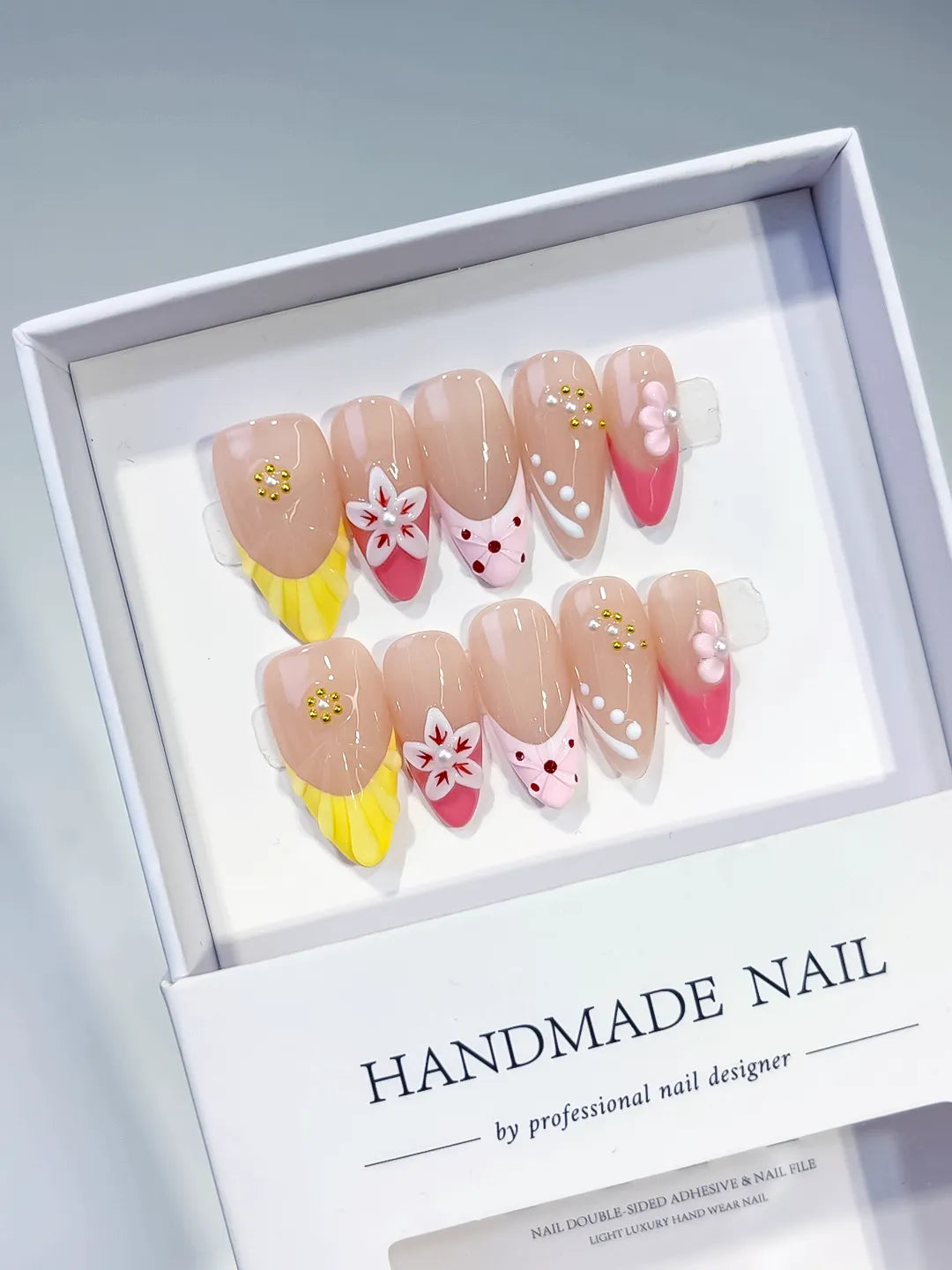 Nude Yellow Pink White Abstract Flower Dot Pattern Stud press on nails angled view