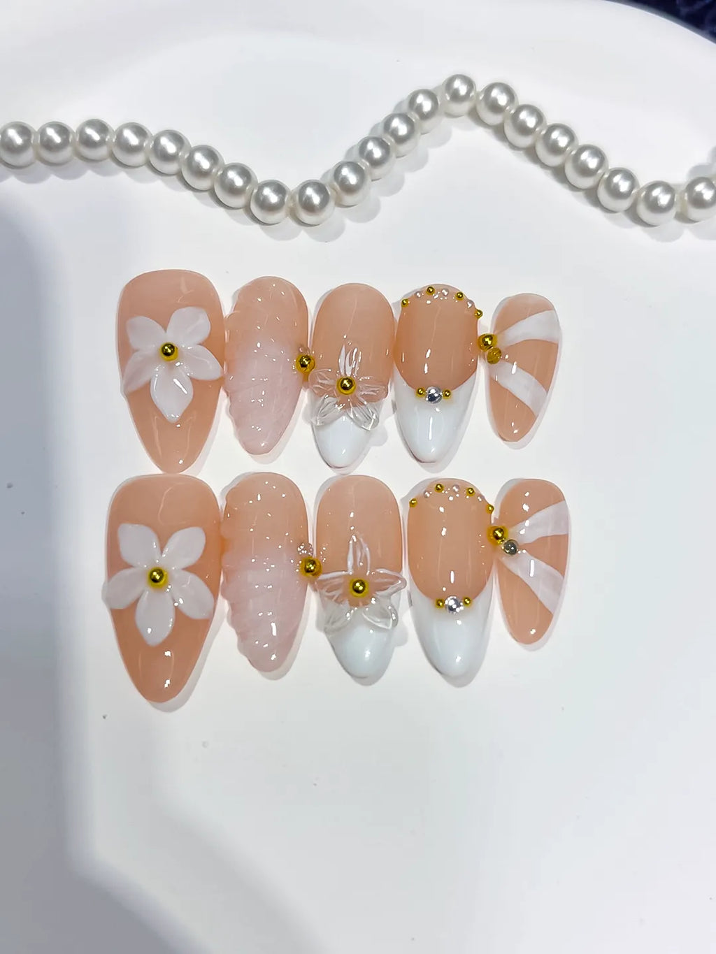 Nude White Pink Gold French tip Flower Shell Glitter press on nails close up