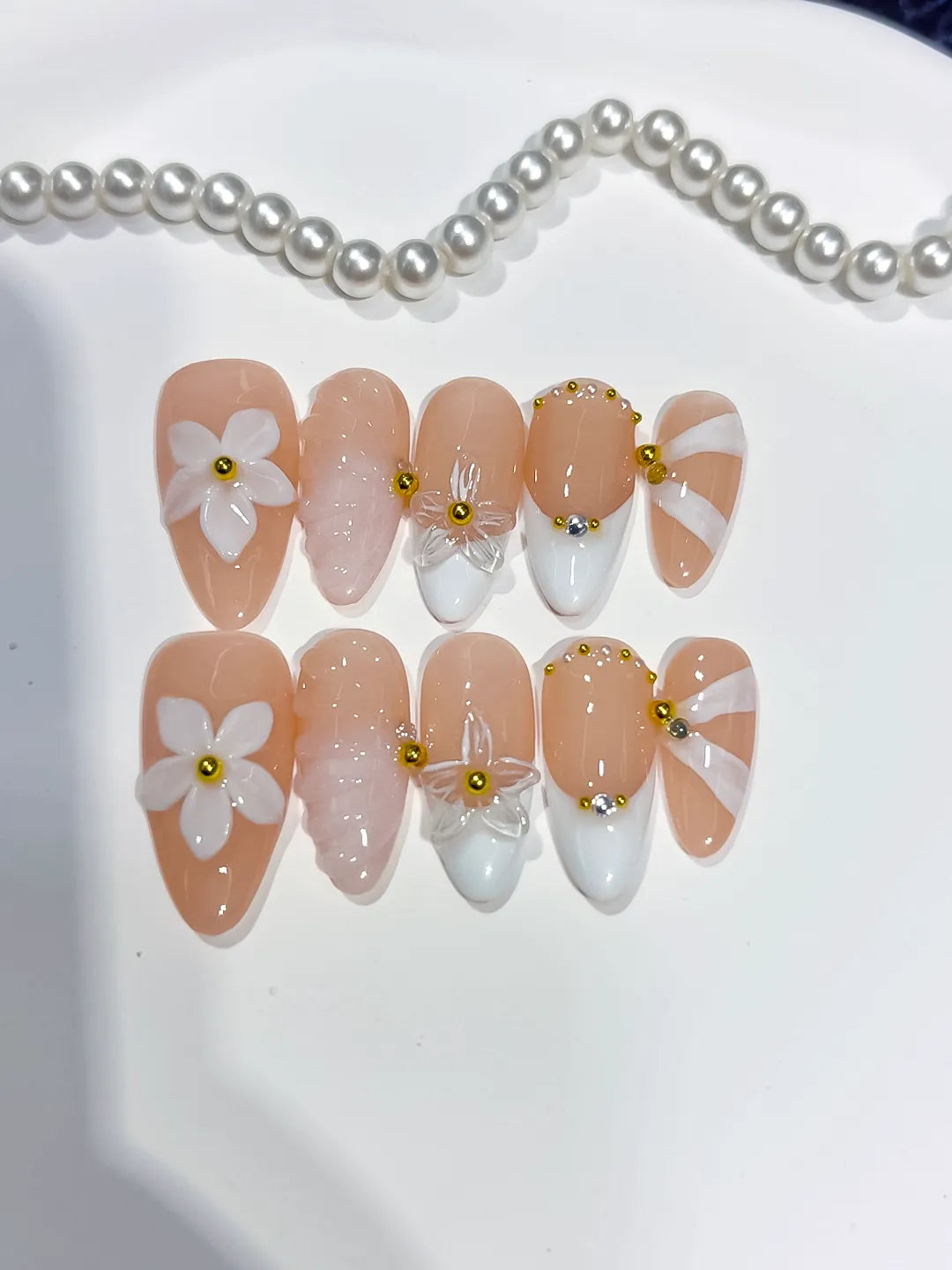 Nude White Pink Gold French tip Flower Shell Glitter press on nails close up