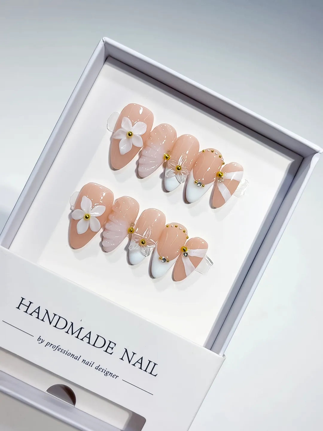 Nude White Pink Gold French tip Flower Shell Glitter press on nails angled view