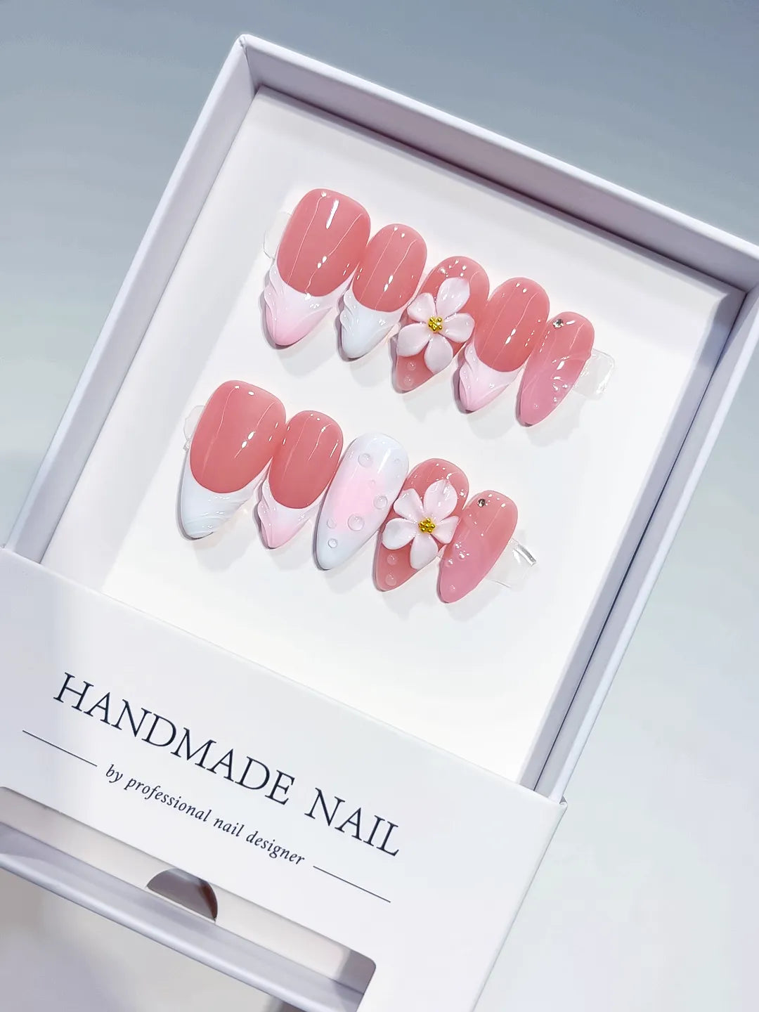 Pink White French tip Flower Shell press on nails angled view