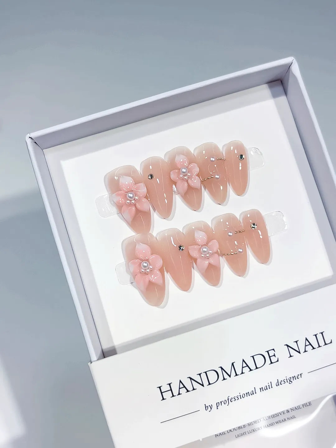 Nude Pink Silver Solid color Flower Pearl Rhinestone press on nails angled view