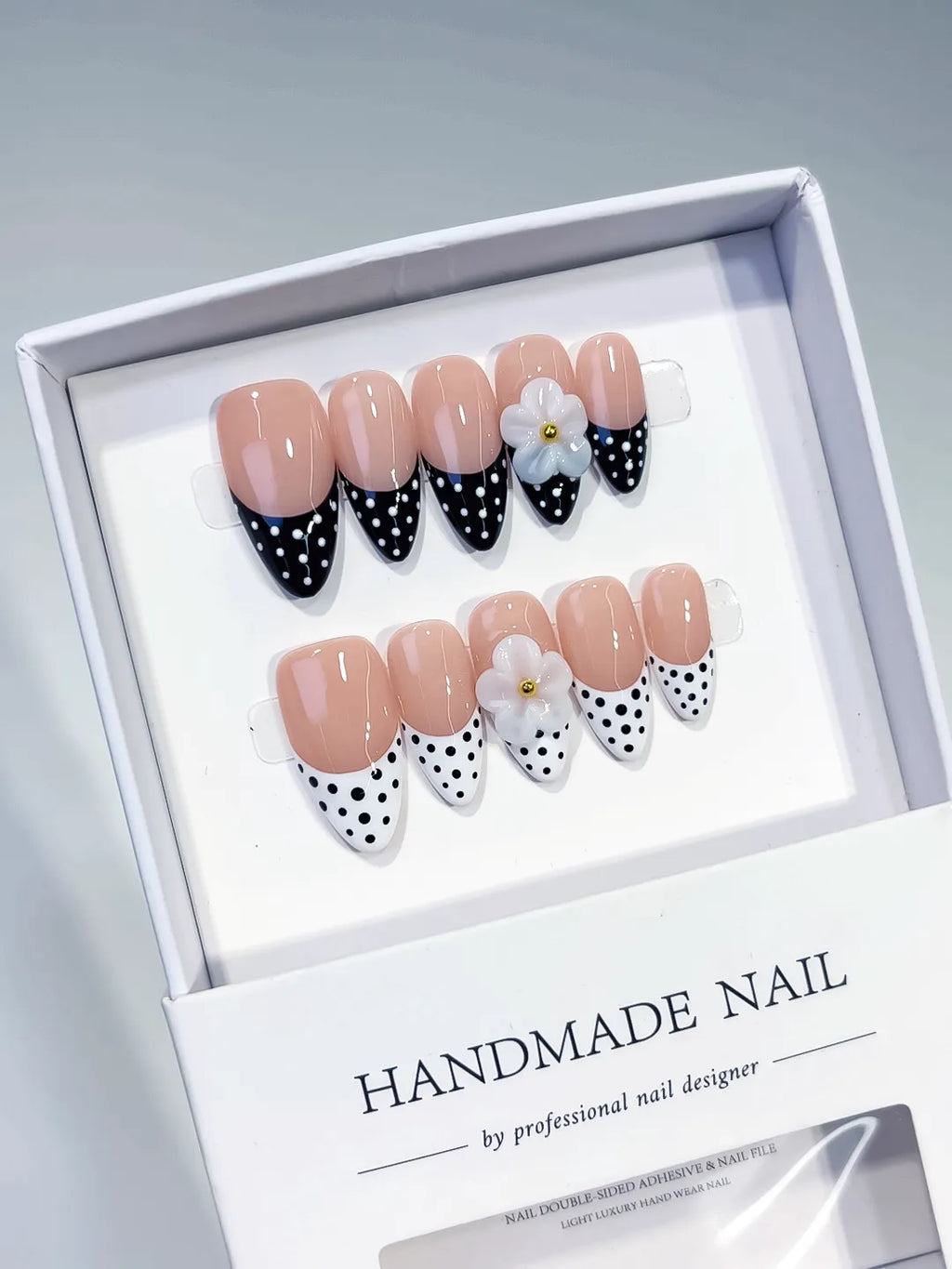 Nude Black White French tip Flower Dot Pattern press on nails angled view