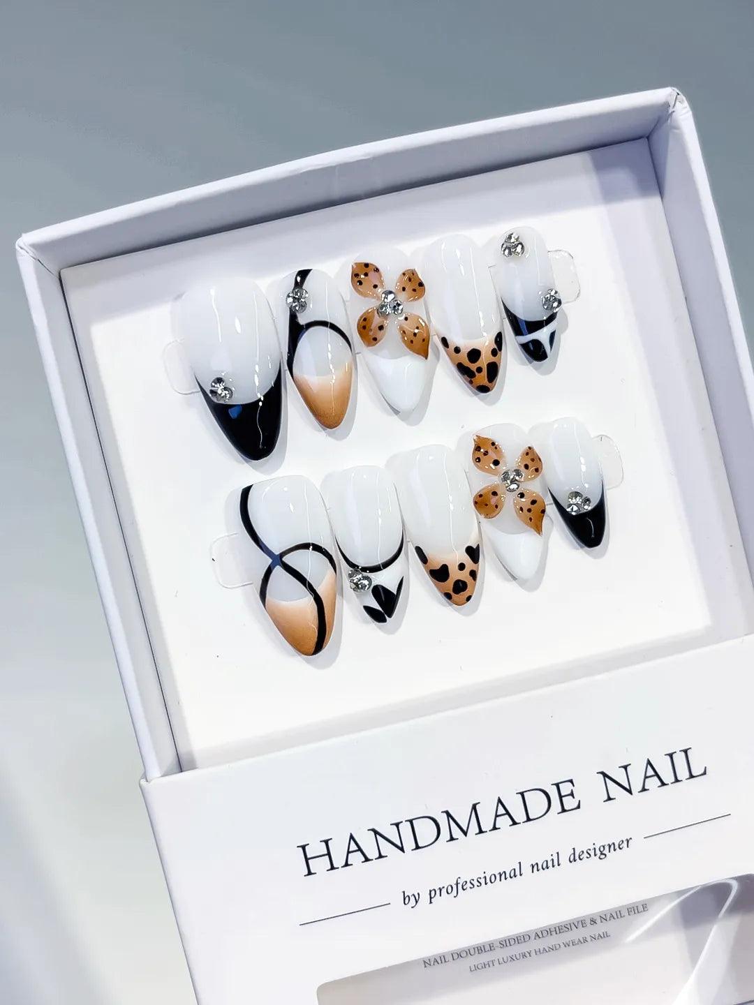 White Black Nude Brown Silver French tip Flower Animal Print Rhinestone press on nails angled view