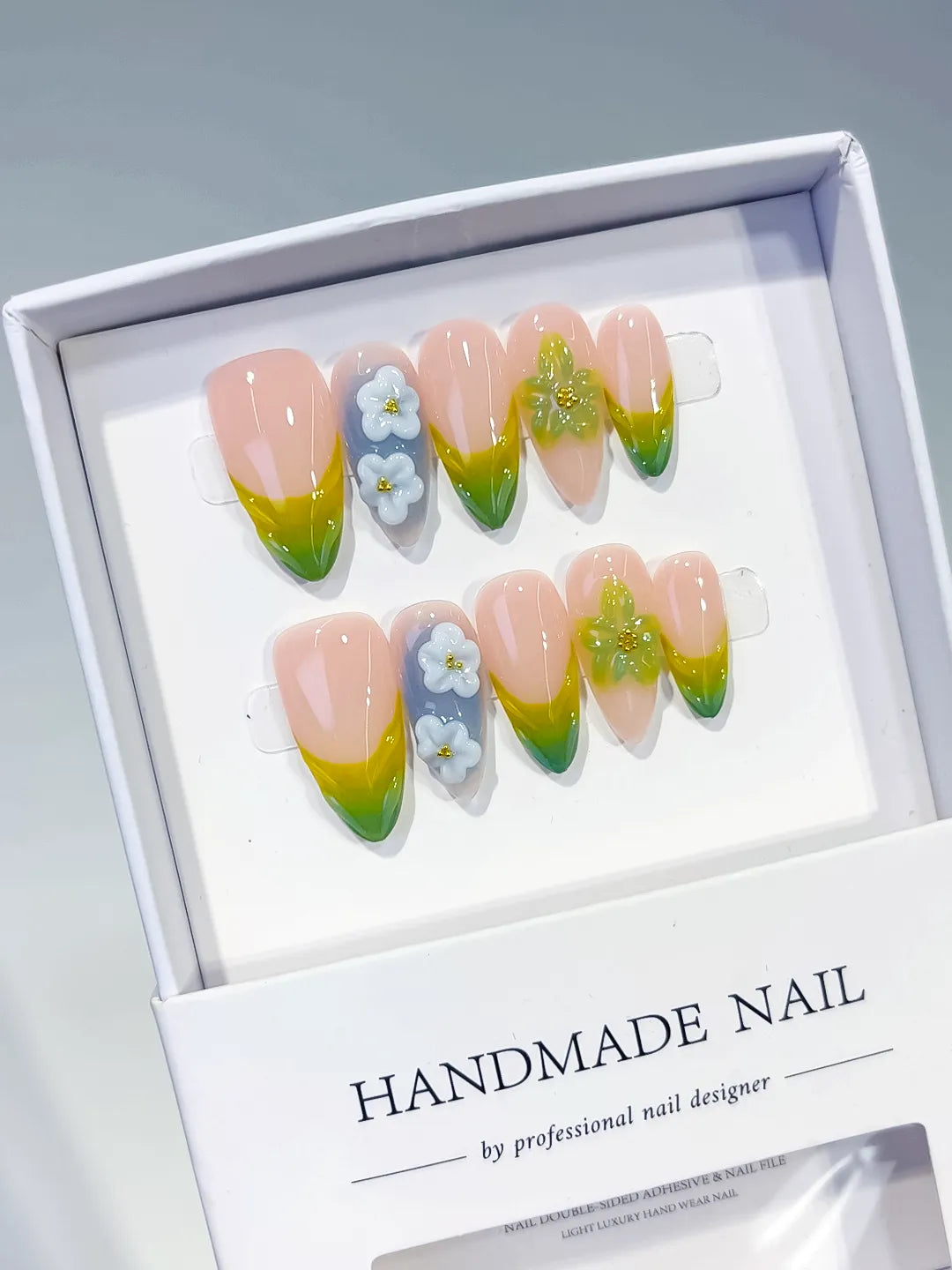 Nude Green Yellow Blue French tip Flower Butterfly press on nails angled view