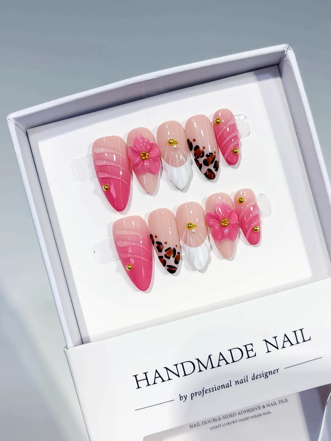 Pink White Brown Gold French tip Flower Animal Print Stud press on nails angled view