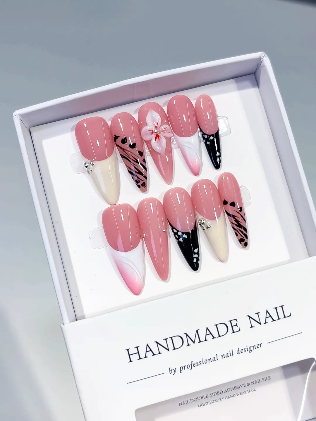 Pink White Black Abstract Flower Animal Print Dot Pattern press on nails angled view