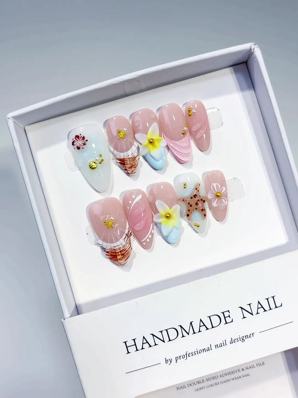 Pink White Brown Yellow Gold Abstract Flower Shell Dot Pattern press on nails angled view