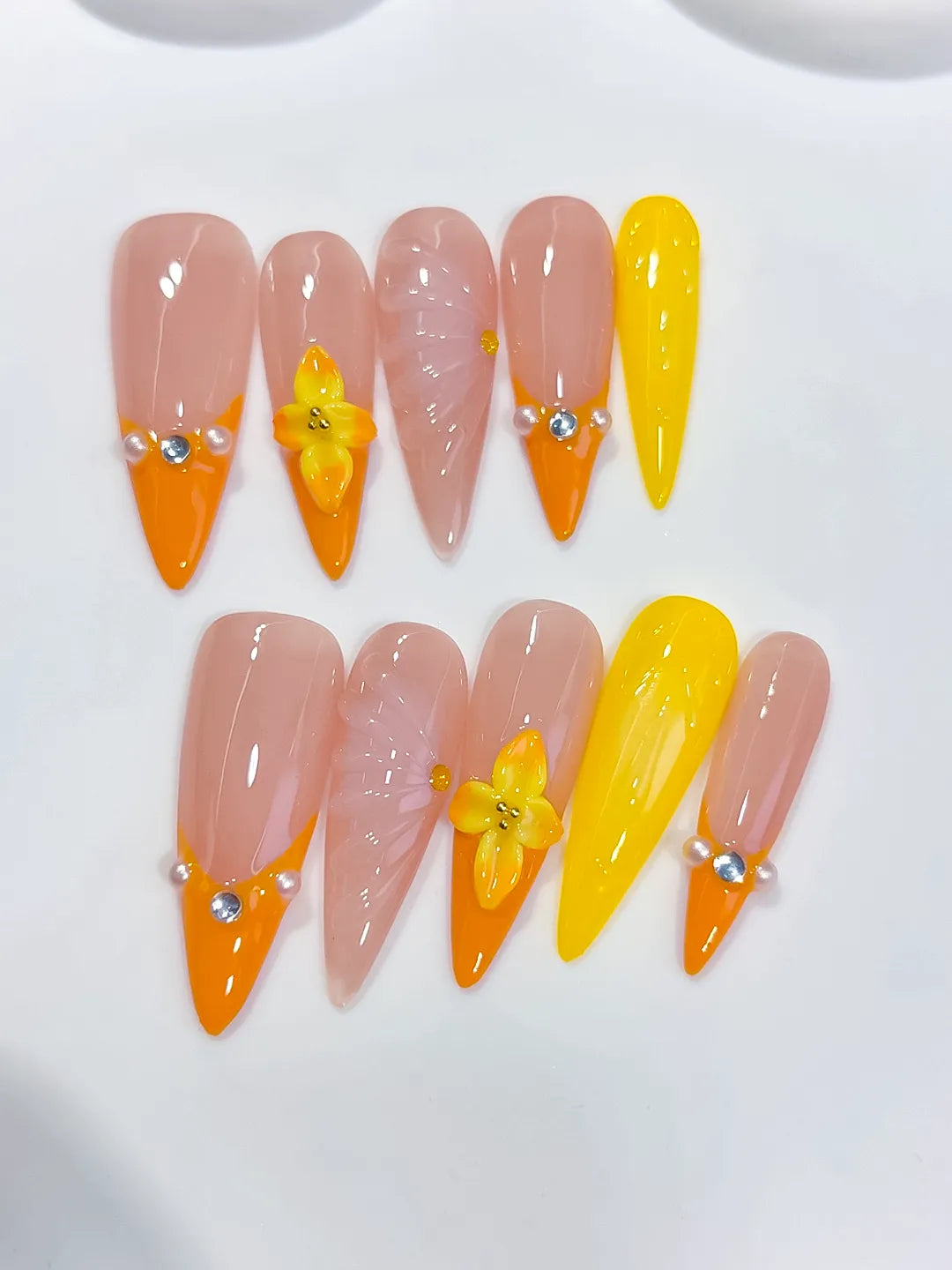 Nude Orange Yellow French tip Flower Shell Rhinestone press on nails close up