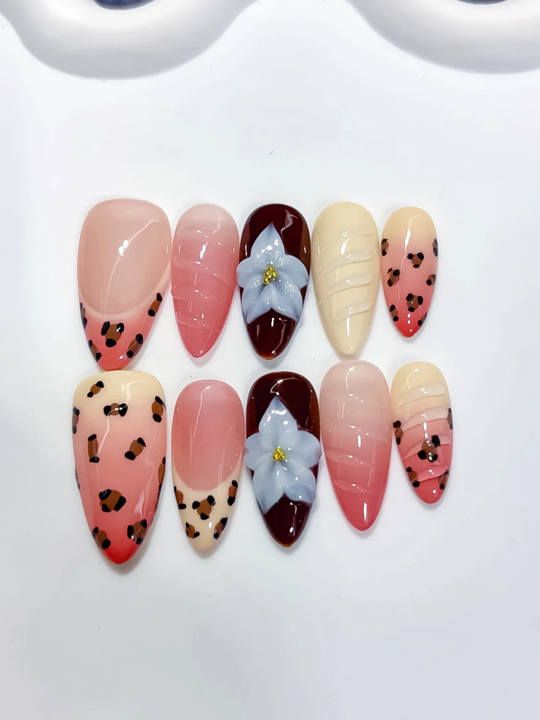 Pink Red Nude Brown Blue Abstract Flower Animal Print Shell press on nails angled view
