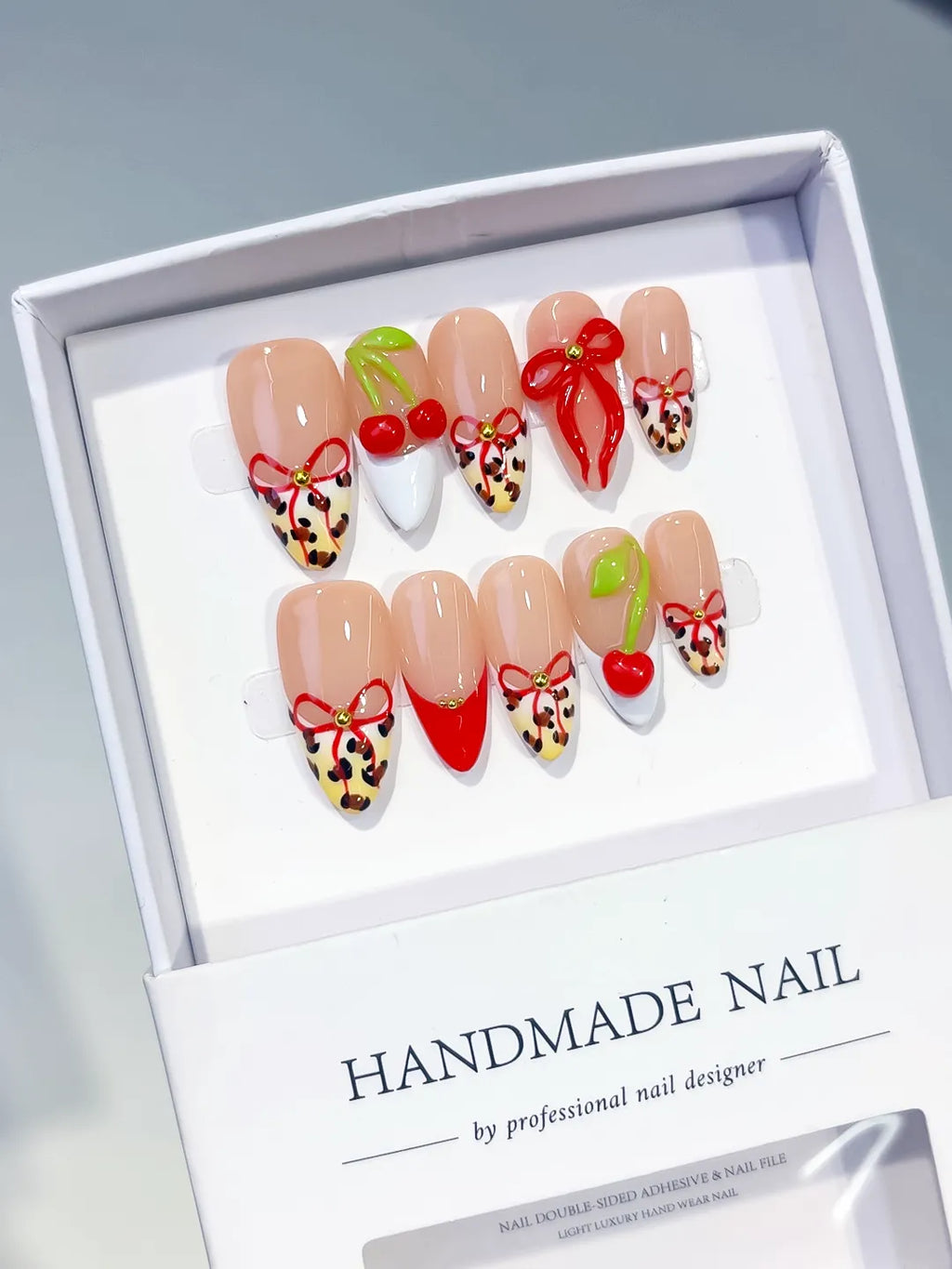Nude Red White Abstract Bow Cherry Animal Print press on nails angled view