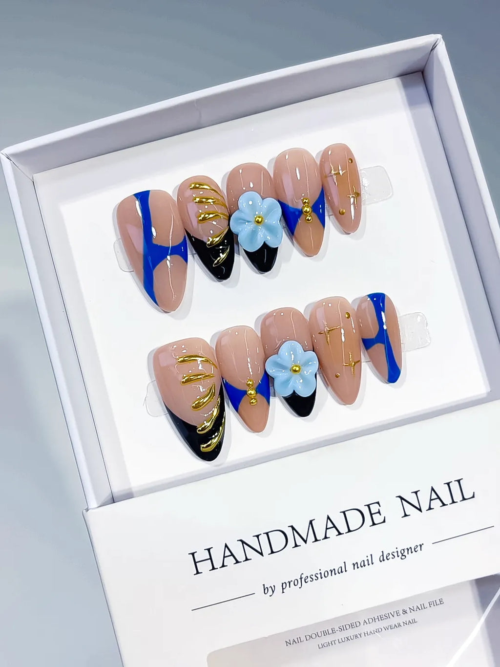 Nude Blue Black Gold Abstract Flower Metallic Charm press on nails angled view