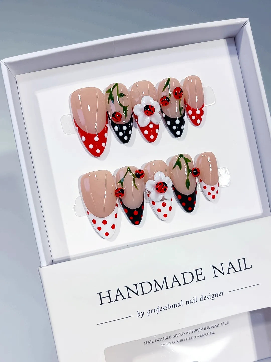 Nude Red Black White French tip Cherry Dot Pattern press on nails angled view