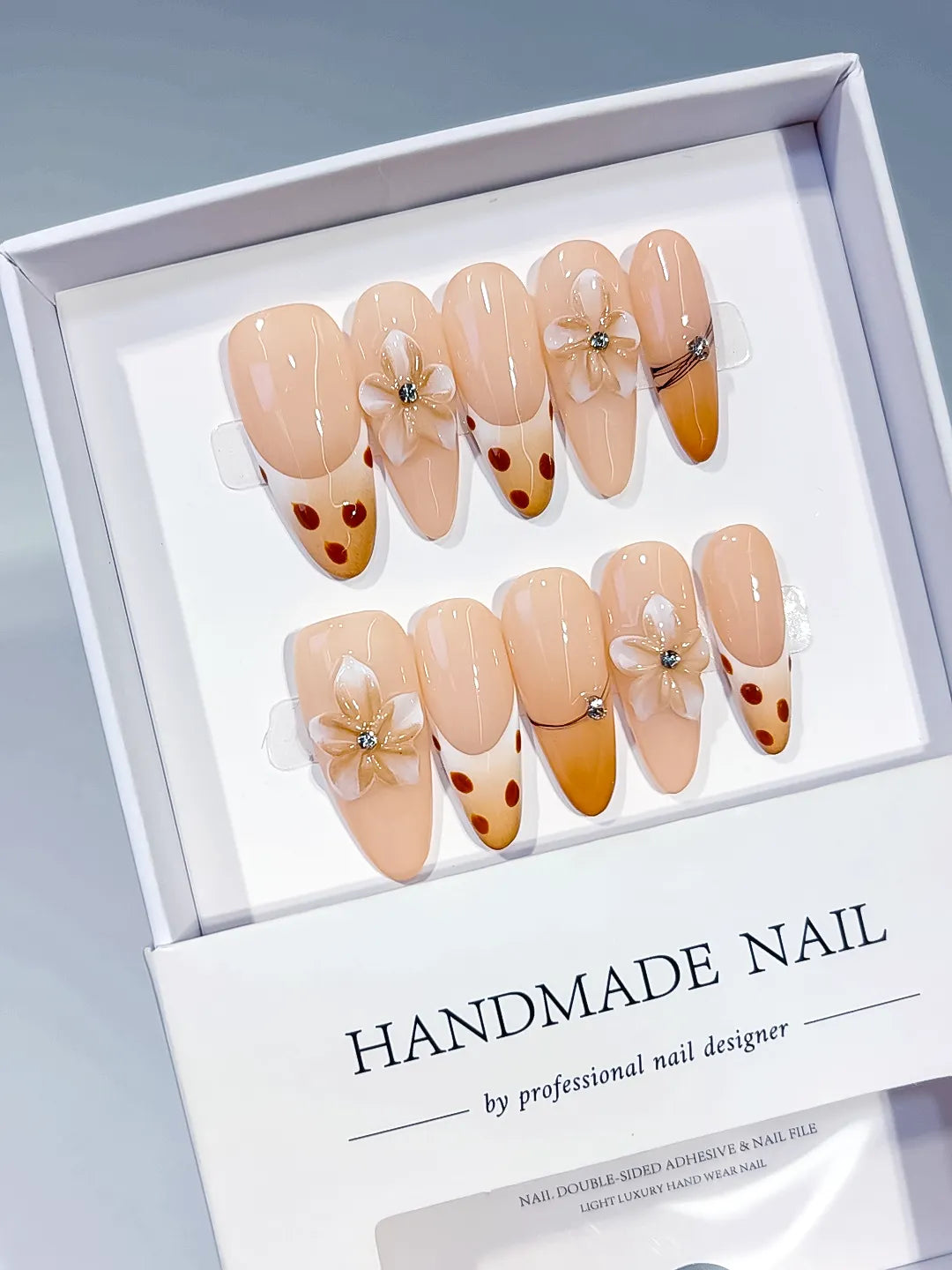Nude Brown French tip Flower Dot Pattern Chain press on nails angled view