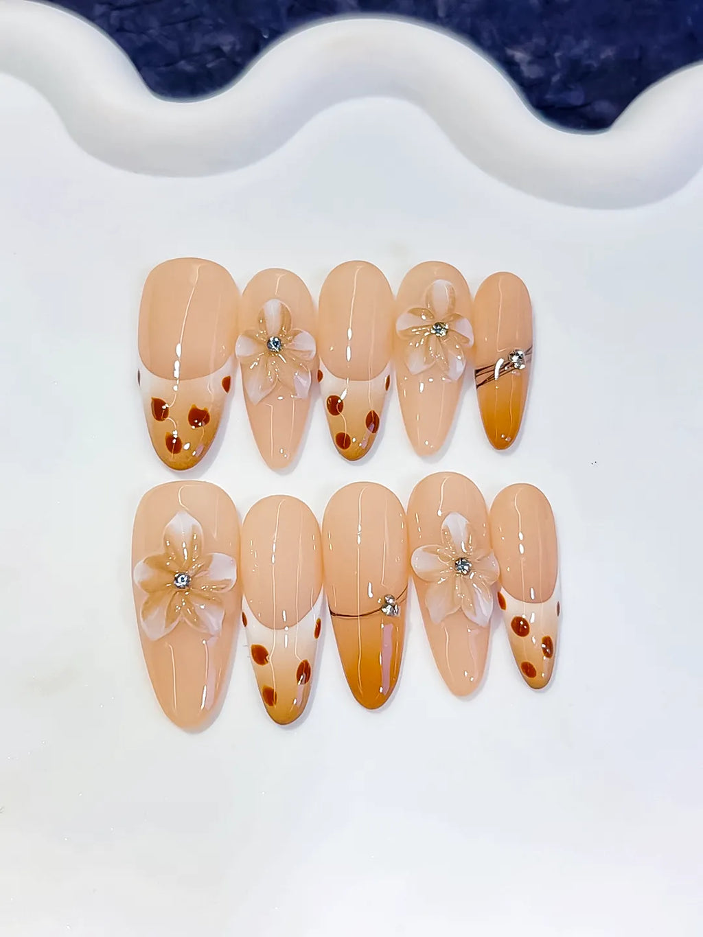 Nude Brown French tip Flower Dot Pattern Chain press on nails close up