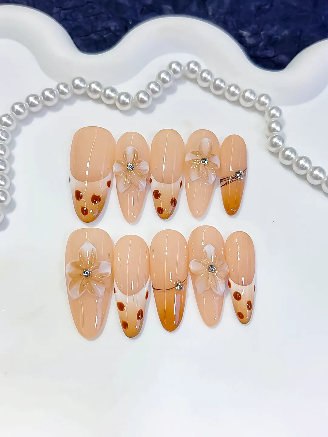 Nude Brown French tip Flower Dot Pattern Chain press on nails detail view
