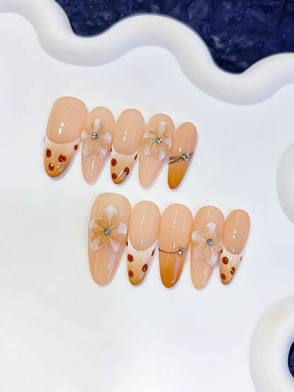 Nude Brown French tip Flower Dot Pattern Chain press on nails detail view