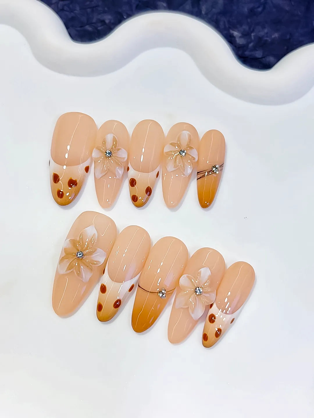 Nude Brown French tip Flower Dot Pattern Chain press on nails detail view