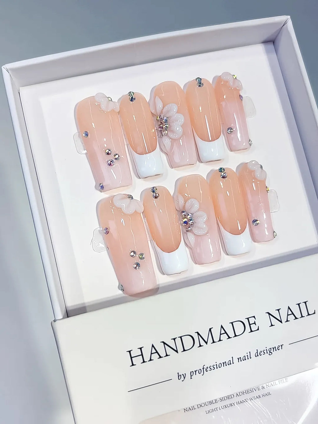 Nude White Silver French tip Flower Rhinestone press on nails angled view