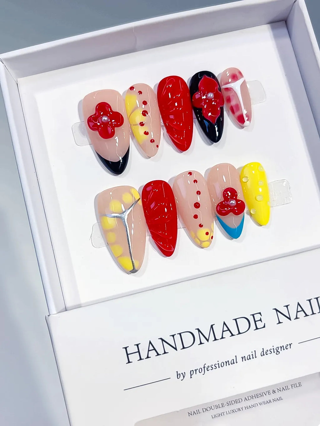 Nude Red Yellow Blue Black Abstract Flower Heart Dot Pattern press on nails angled view