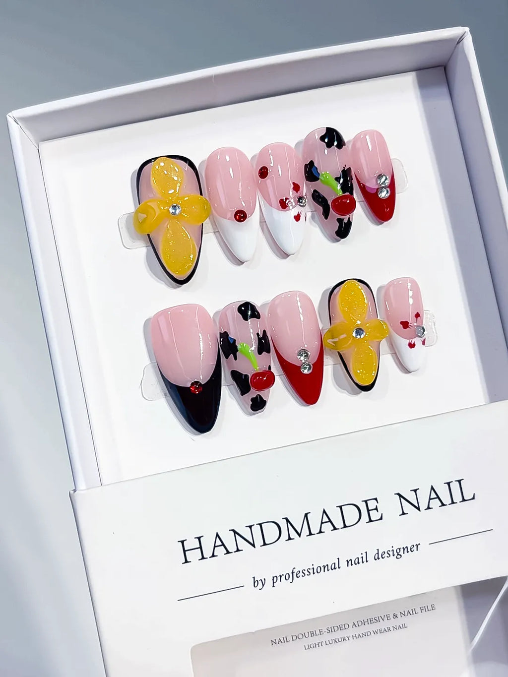 Nude Pink Black Red Yellow Abstract Flower Cherry Animal Print press on nails angled view