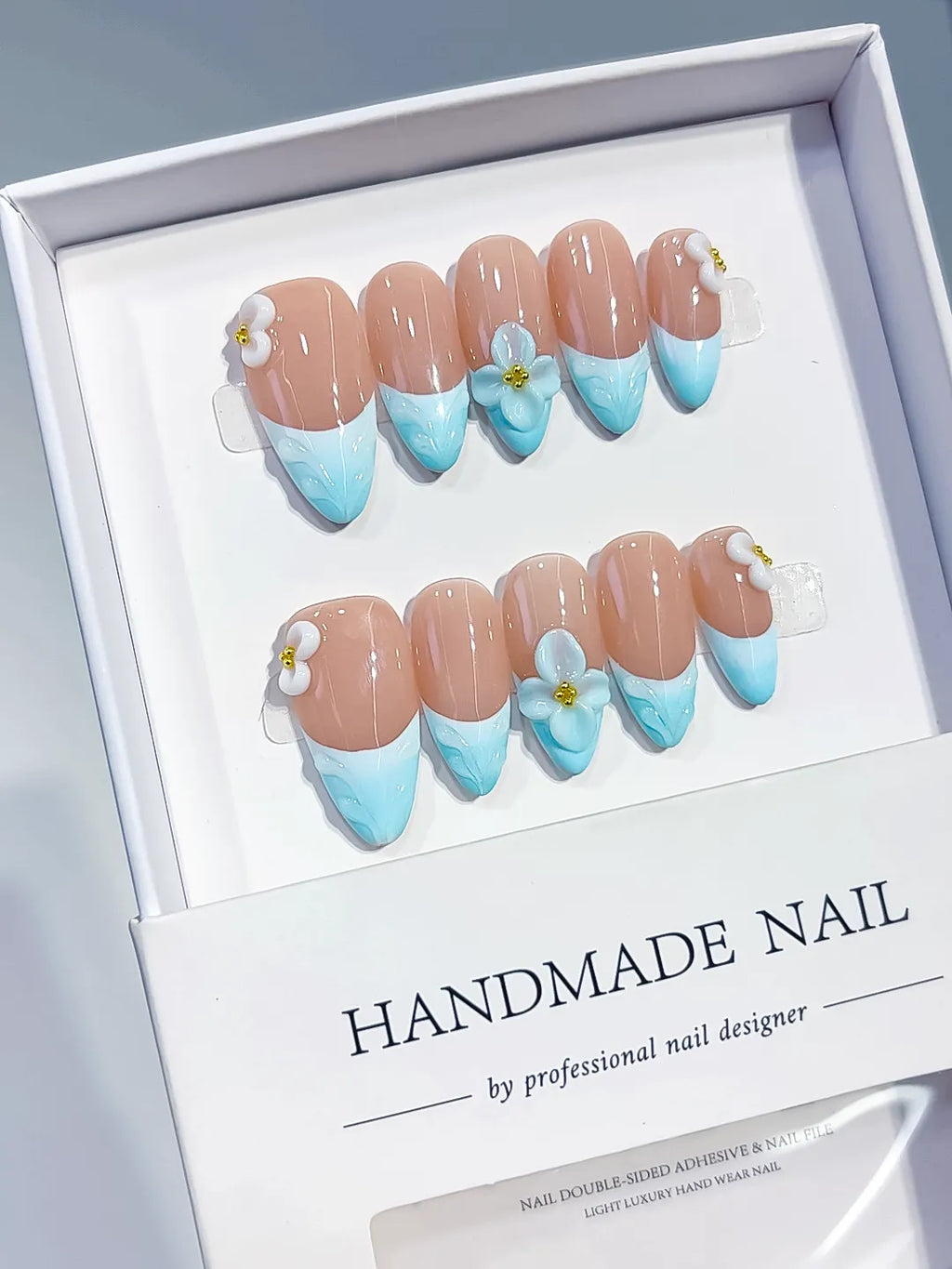 Nude Blue White French tip Flower Bow press on nails angled view