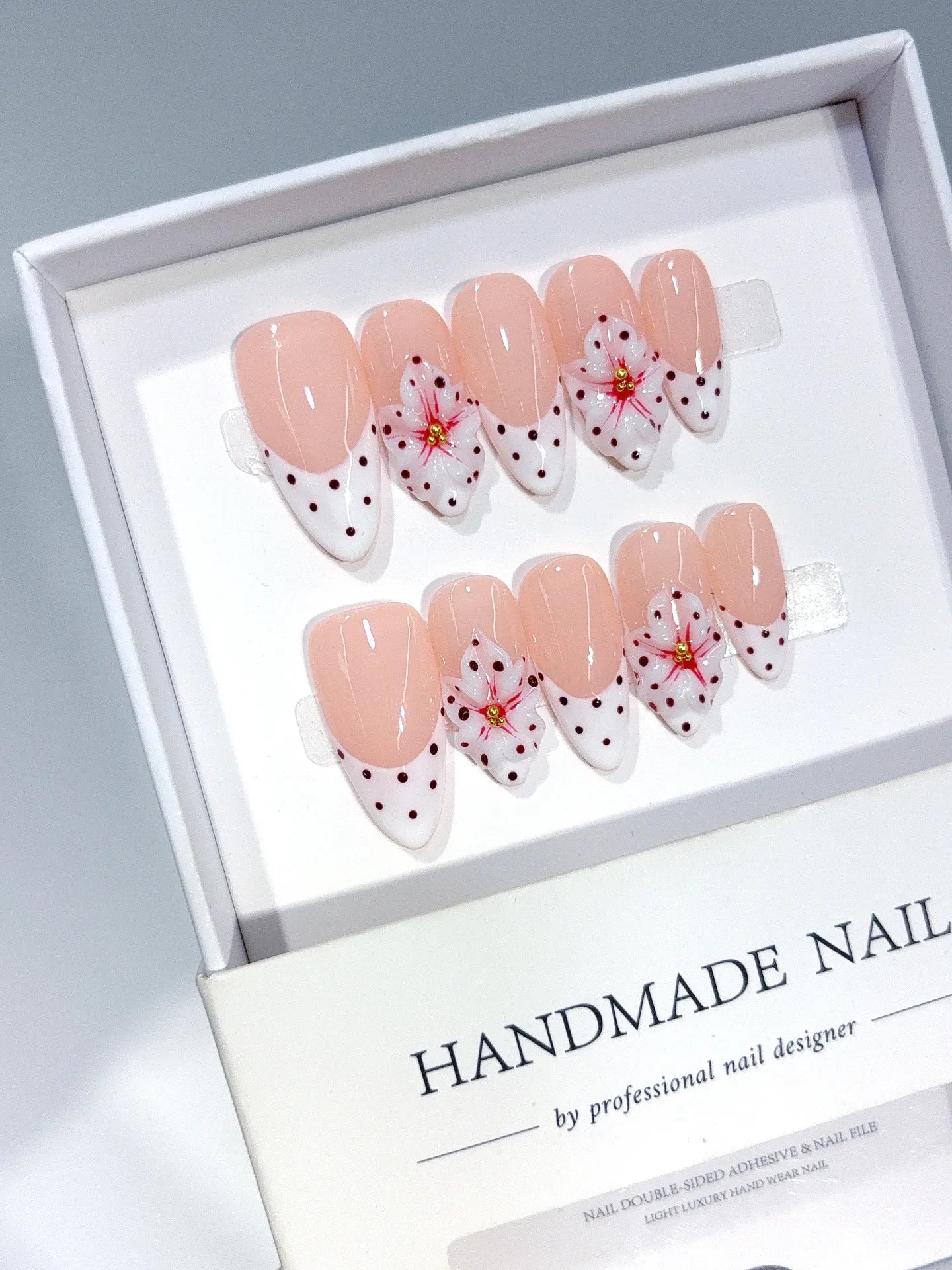 D652 - Medium Nude Pink Almond French Tip Polka Dot Bows - view 1