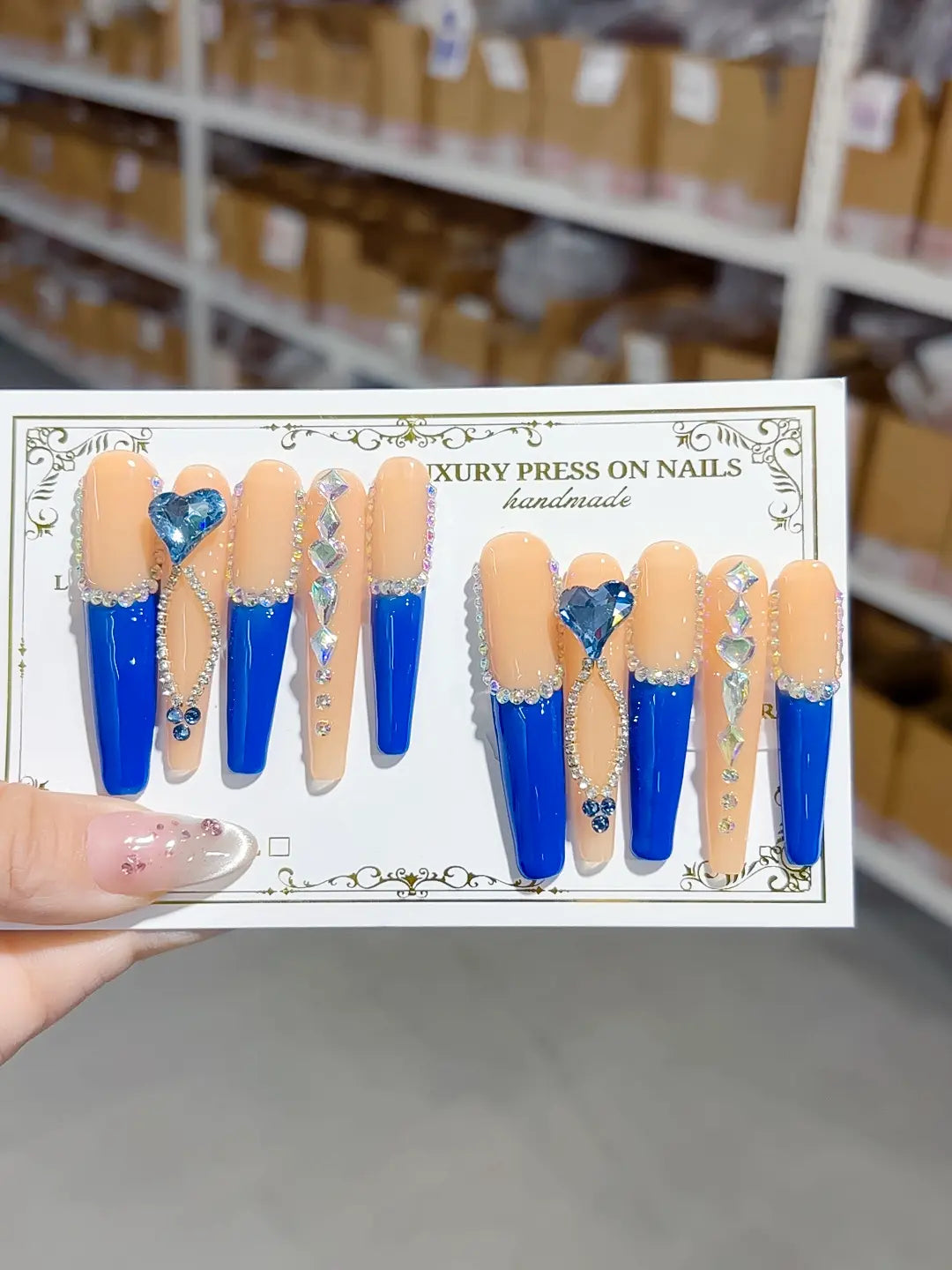 Full set layout: long coffin blue French with 3D hearts and iridescent crystal accents