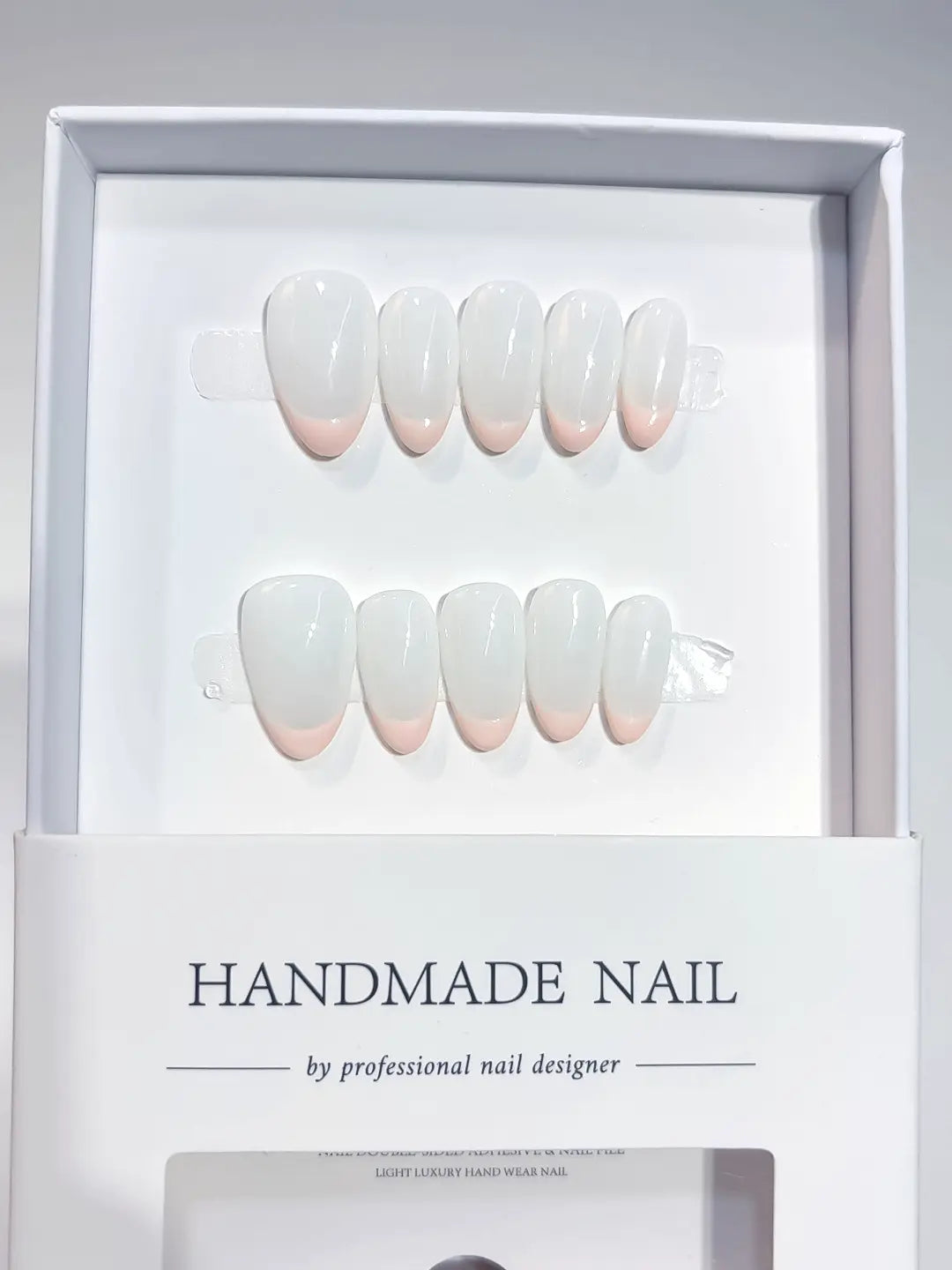 Full set of minimalist short almond handmade press on nails featuring a natural polished finish.
