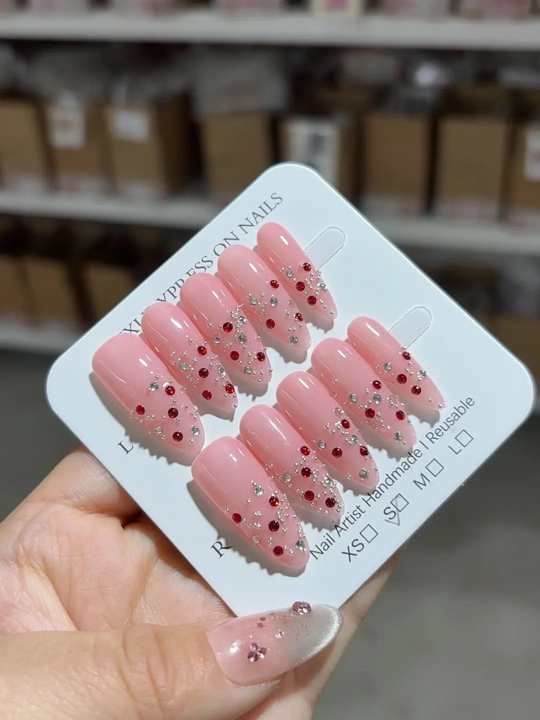 Handmade press on nails long almond pink glitter with rhinestones centerpiece view