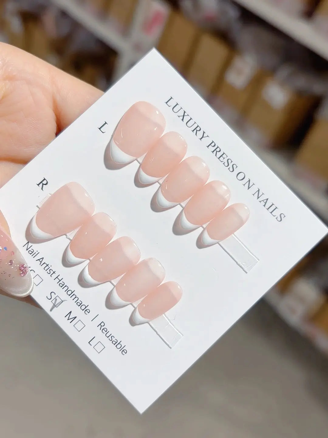 Handmade press on nails reusable nude almond with delicate mini French tips, full set display