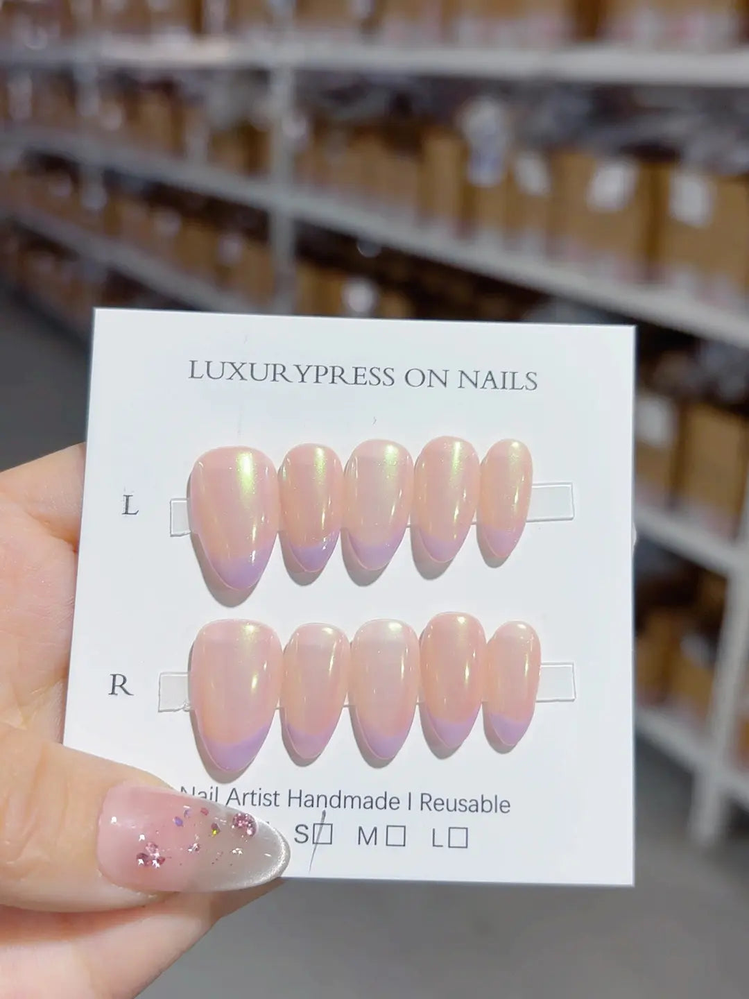 Handmade press on nails short almond nude with aurora shimmer, centerpiece view
