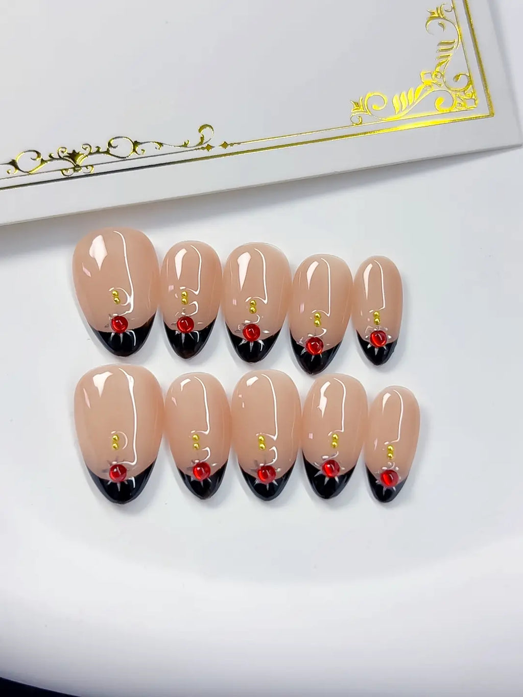 Handmade press on nails short almond nude with luxury rose accent close-up