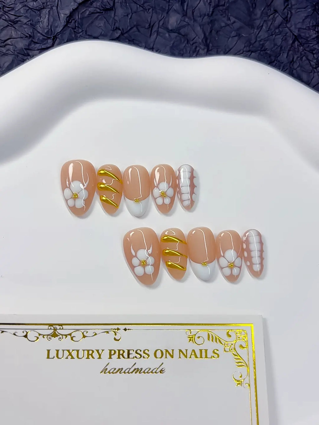 Handmade press on nails short almond nude with luxury white tips close-up