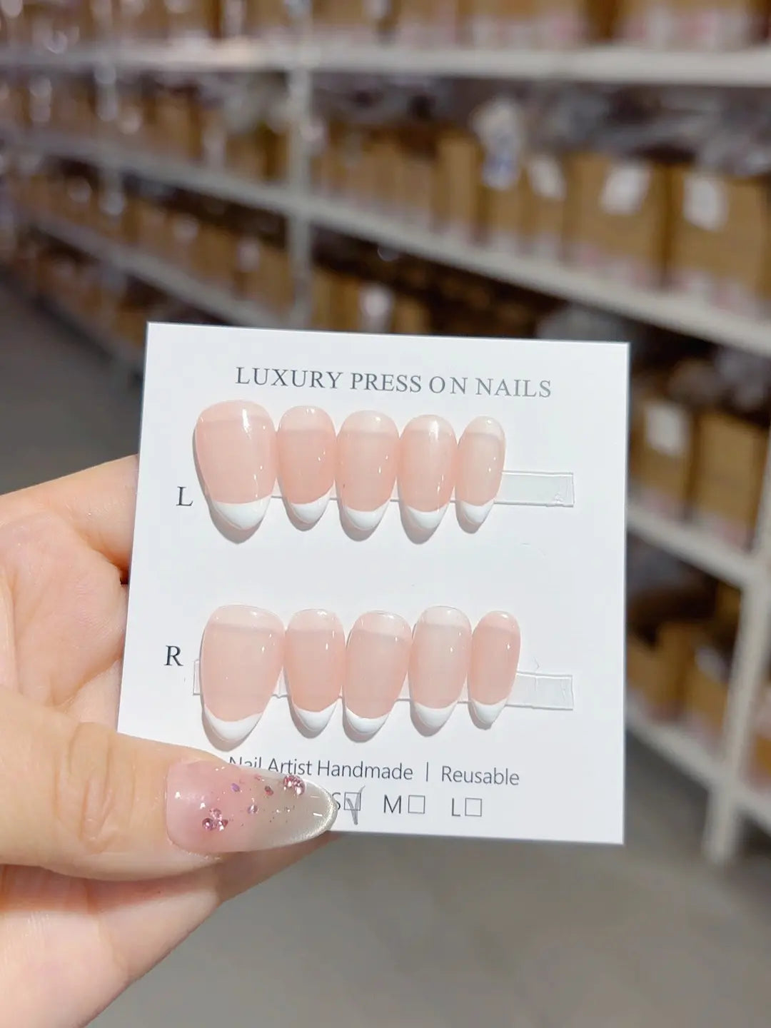 Handmade press on nails short almond nude with mini French tips, centerpiece view