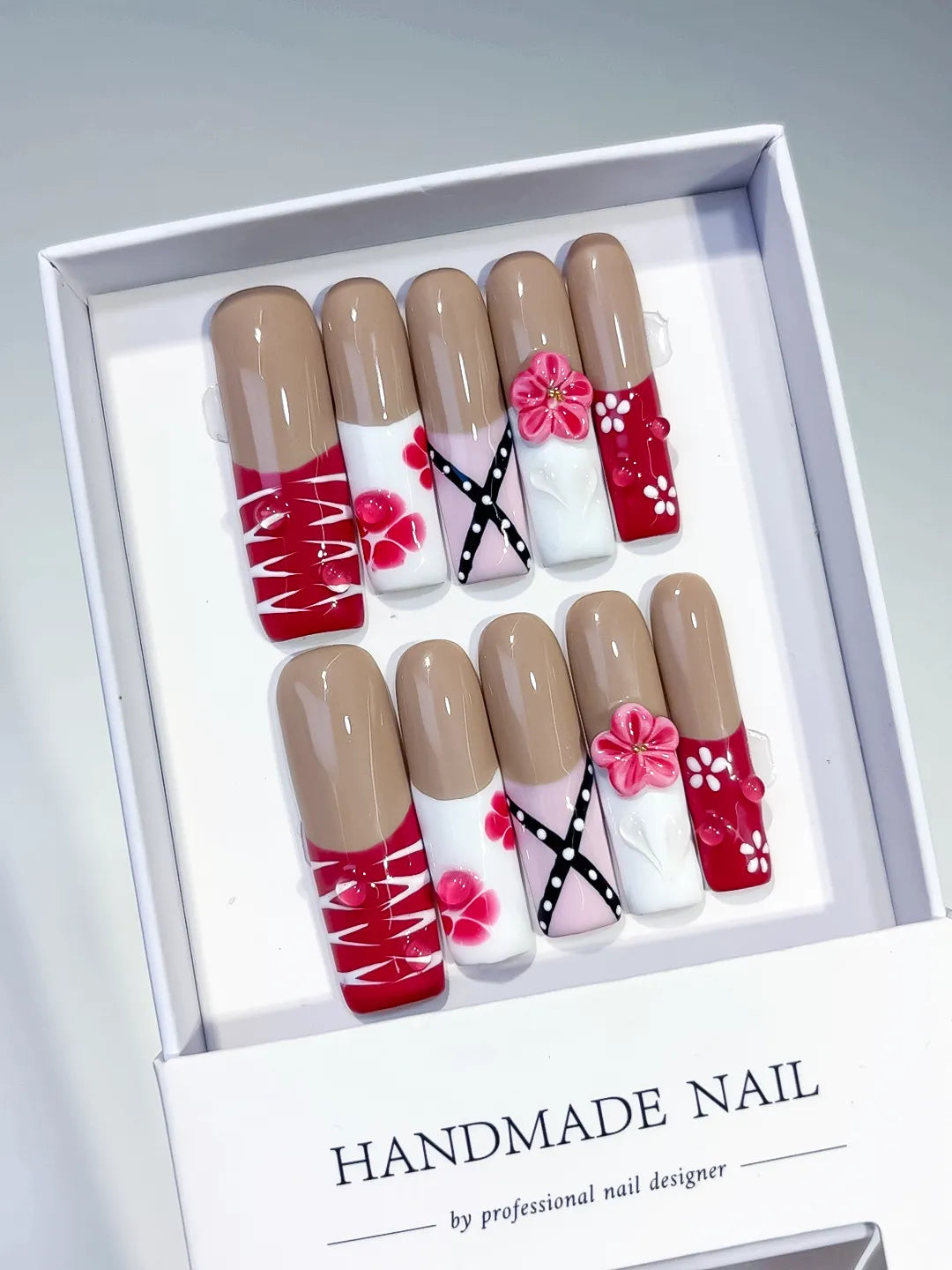 Nude Red White Pink Black Abstract Flower Ribbon 3D press on nails angled view