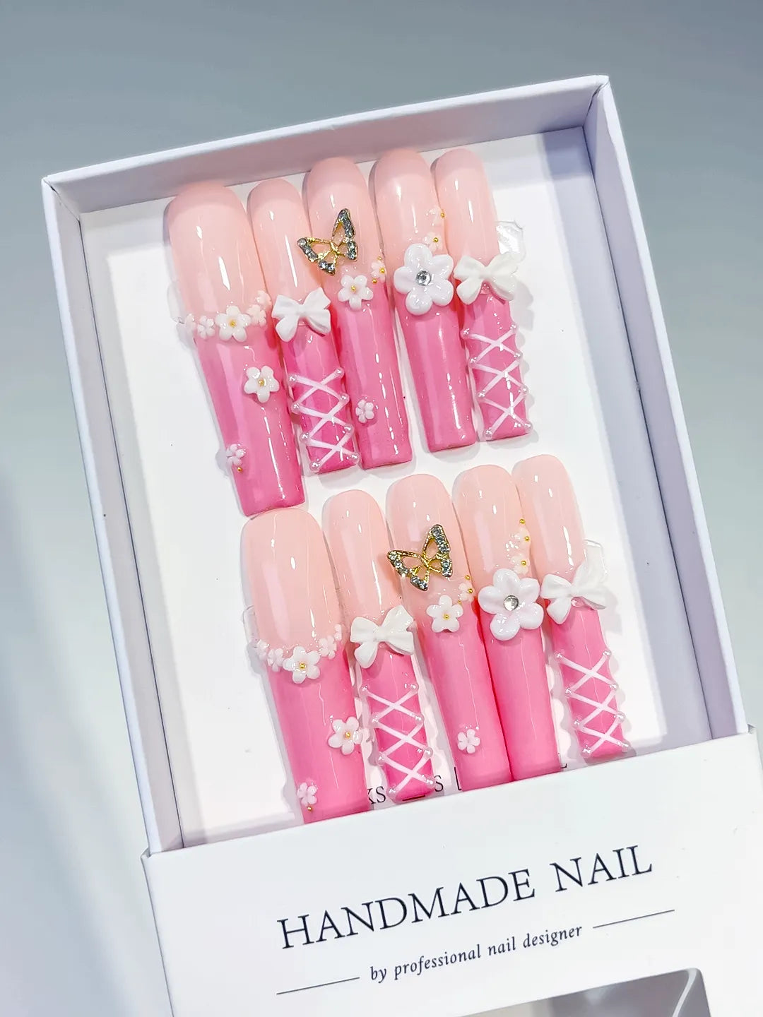 Pink White Gold Ombre Butterfly Bow Flower 3D press on nails angled view
