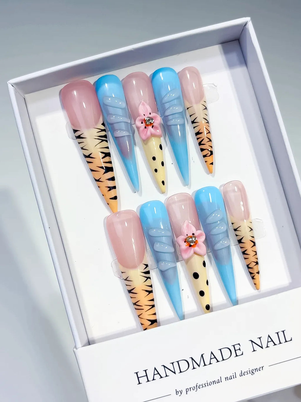 Nude Blue Yellow Black Pink Abstract Flower Animal Print Rhinestone press on nails angled view