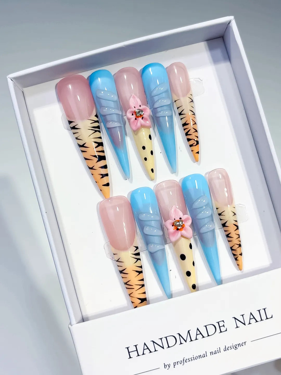 Nude Blue Yellow Black Pink Abstract Flower Animal Print Rhinestone press on nails angled view