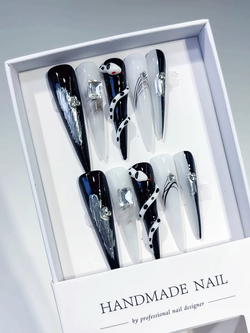 Black White Silver Blue Abstract Rhinestone Metallic Accent 3D press on nails angled view