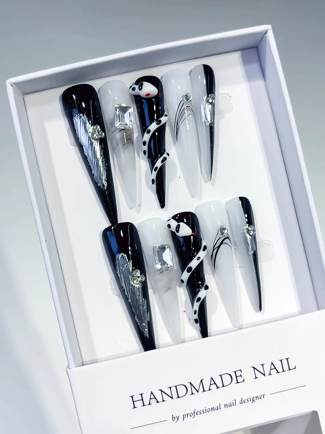 Black White Silver Blue Abstract Rhinestone Metallic Accent 3D press on nails angled view