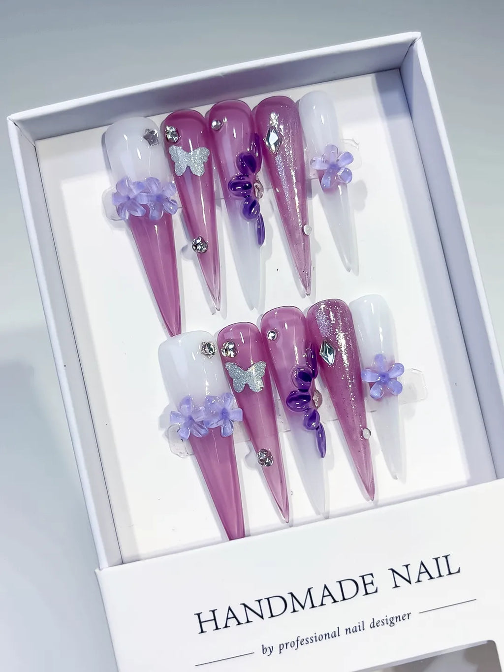 Purple Pink White Silver Glitter Flower Butterfly Rhinestone 3D press on nails angled view