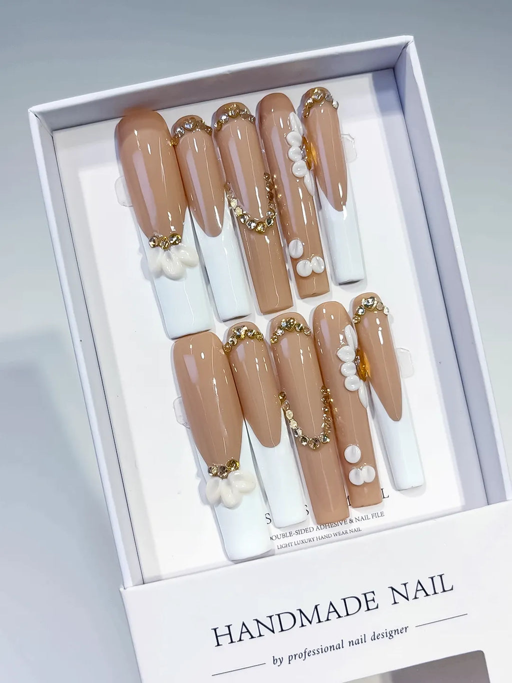 Nude White Gold French tip Flower Pearl Rhinestone Gold Bead press on nails angled view
