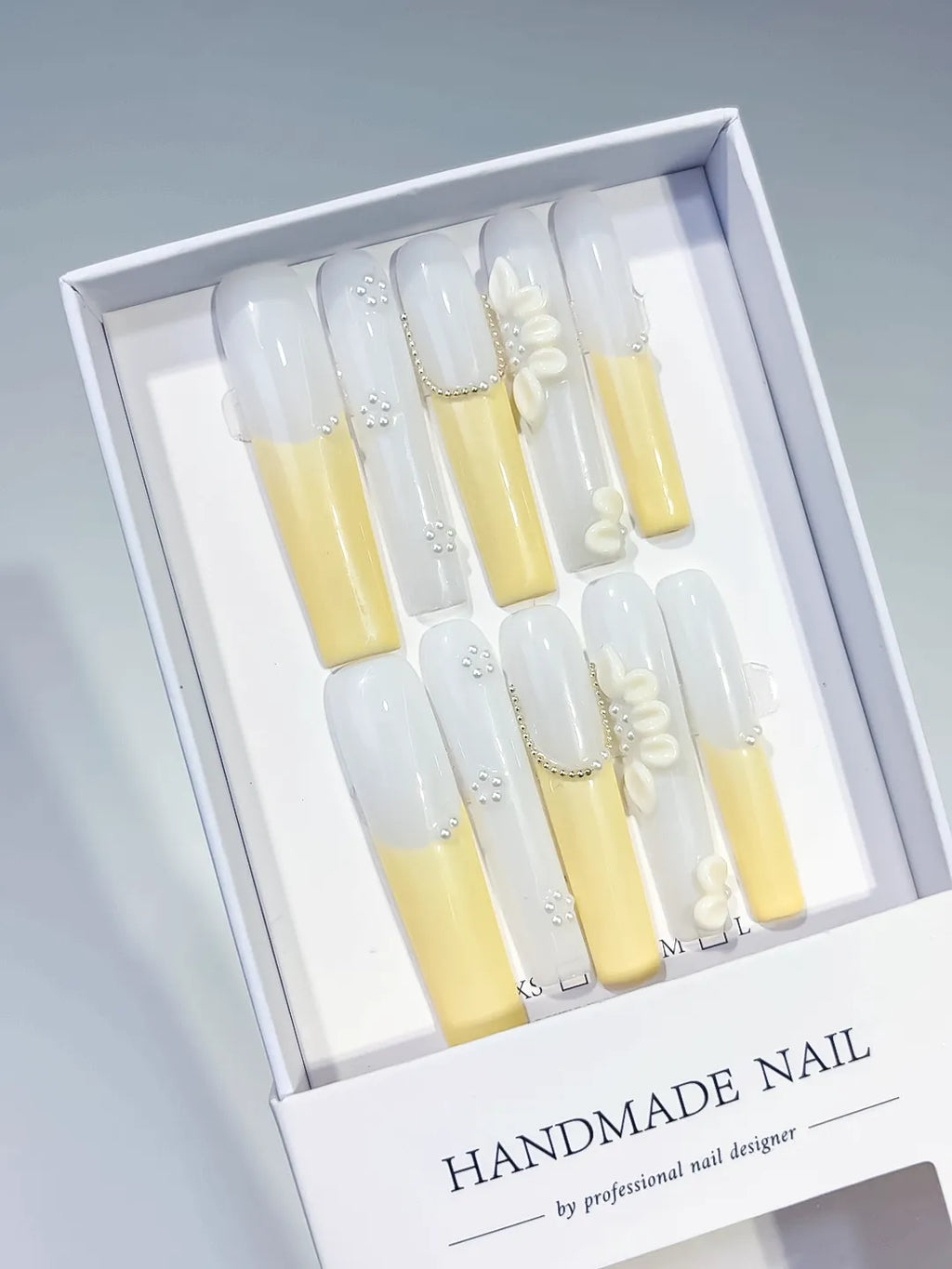 White Yellow Silver French tip Flower Pearl Chain press on nails angled view