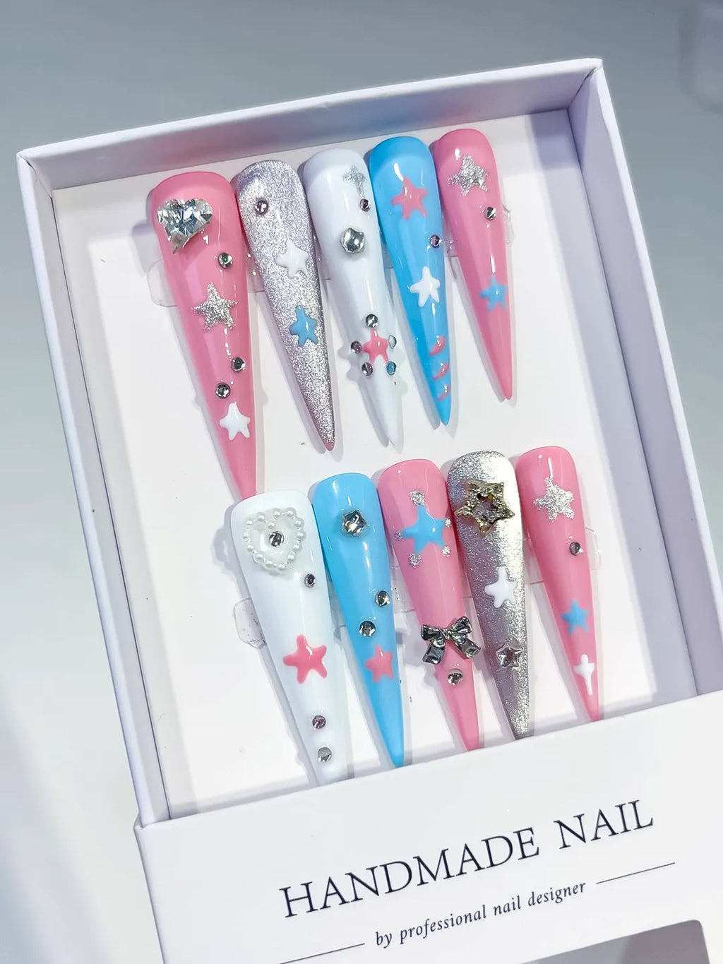 Pink Blue White Silver Abstract Star Bow Heart Rhinestone Glitter press on nails angled view